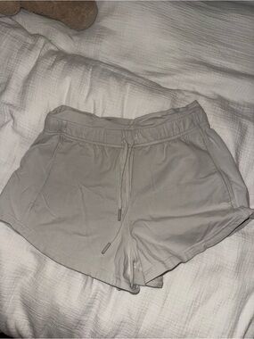 lululemon inner glow high rise shorts in bone